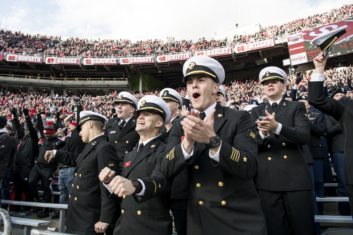 Military and ROTC members cheer on the Buckeyes football team in Ohio Stadium.