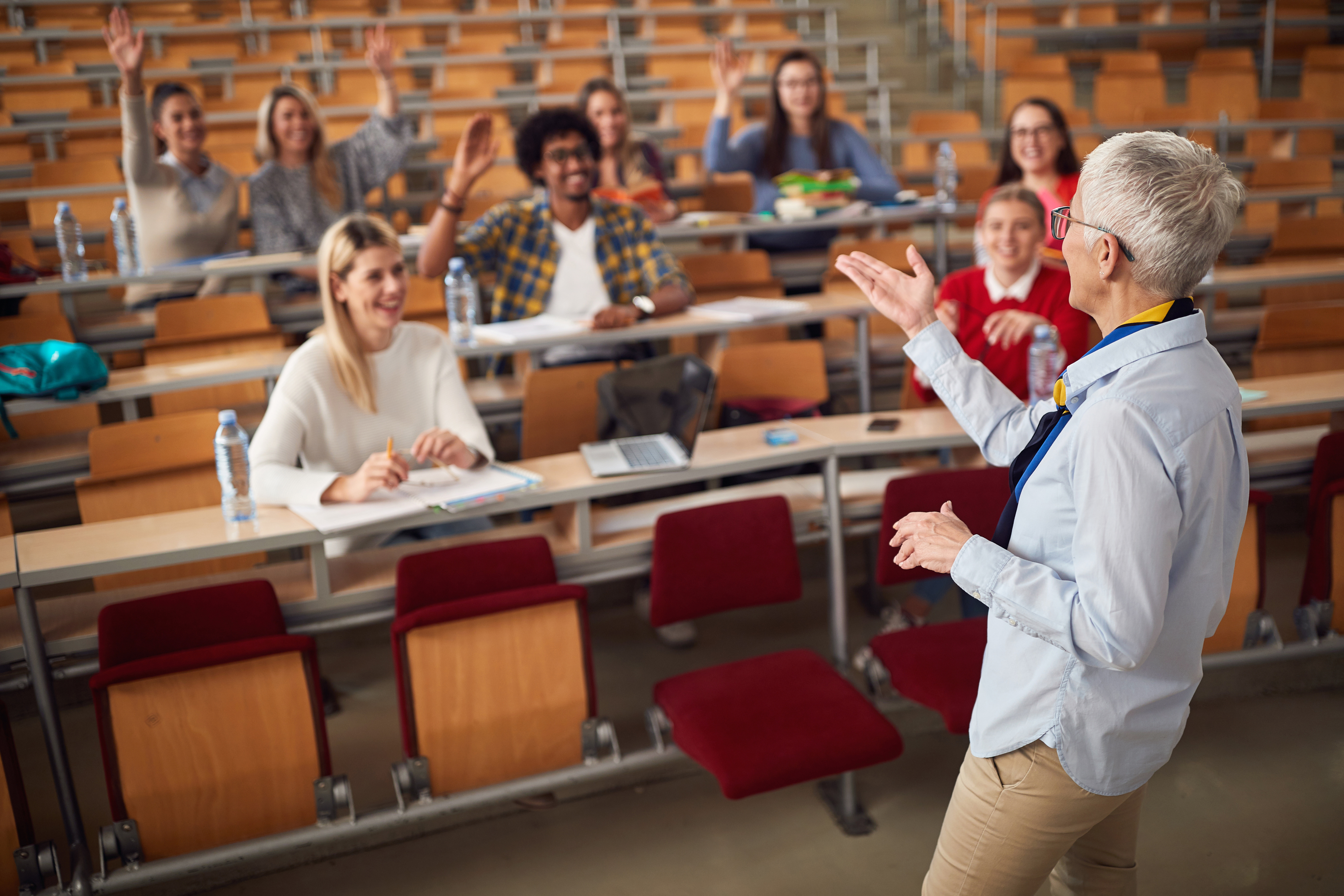 professor lectures to class from the stage.