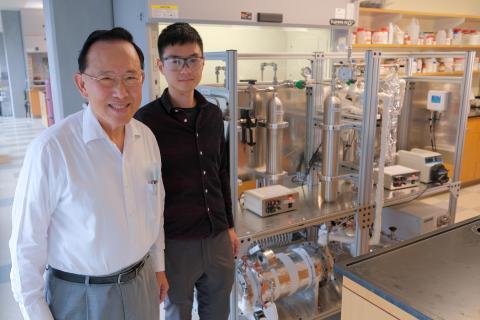 Professor Winston Ho and Research Scientist Yang Han next to their test unit with a 35-square-meter membrane module located at the bottom of the unit, demonstrating their transformational membrane technology’s ability to capture approximately 1 metric ton of carbon dioxide per day.