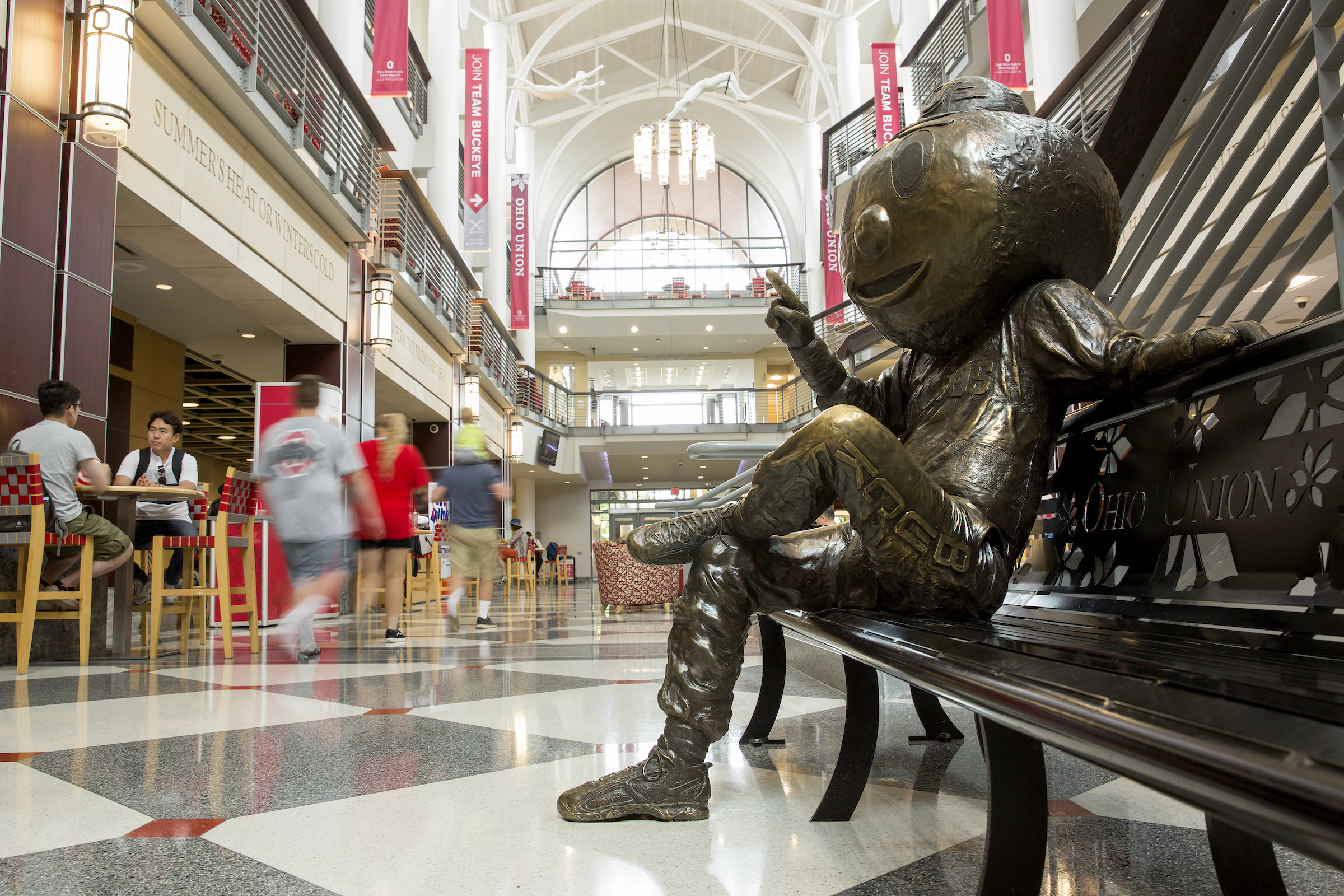 Brutus Buckeye statue sits on a bench in the Ohio Union.