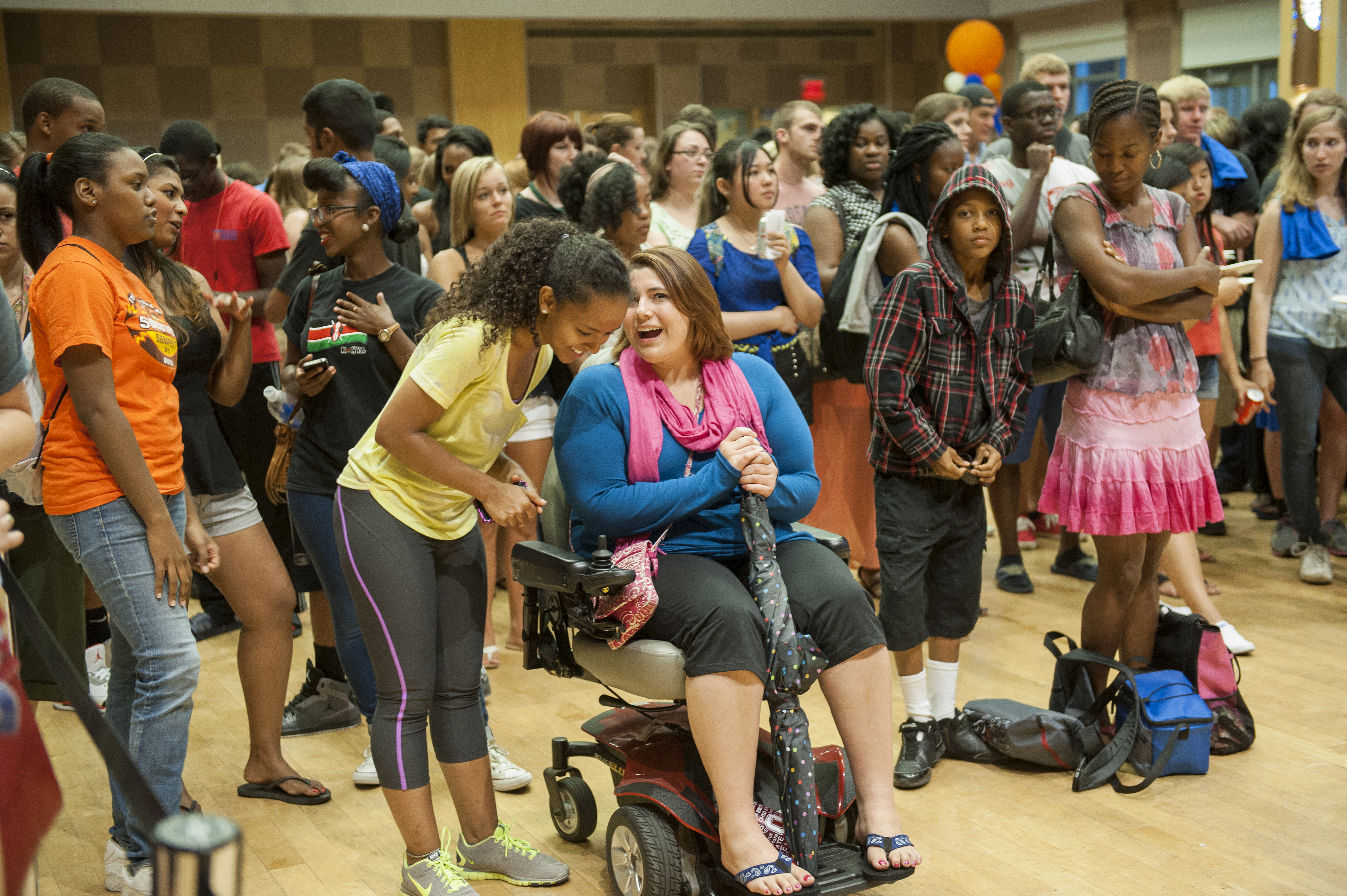 A diverse group of students and faculty at a university event.