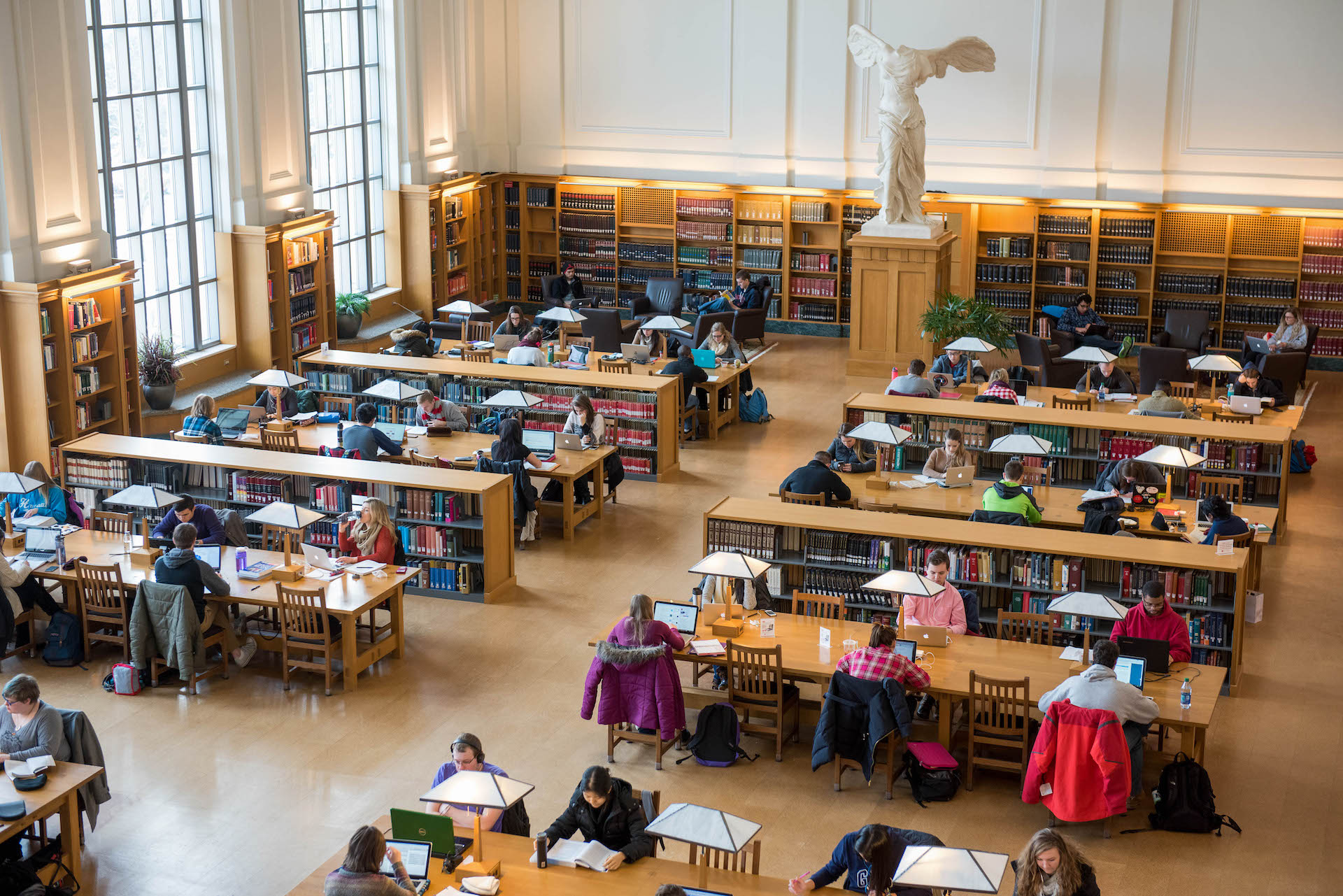 A picture of students studying at desks inside Thompson Library