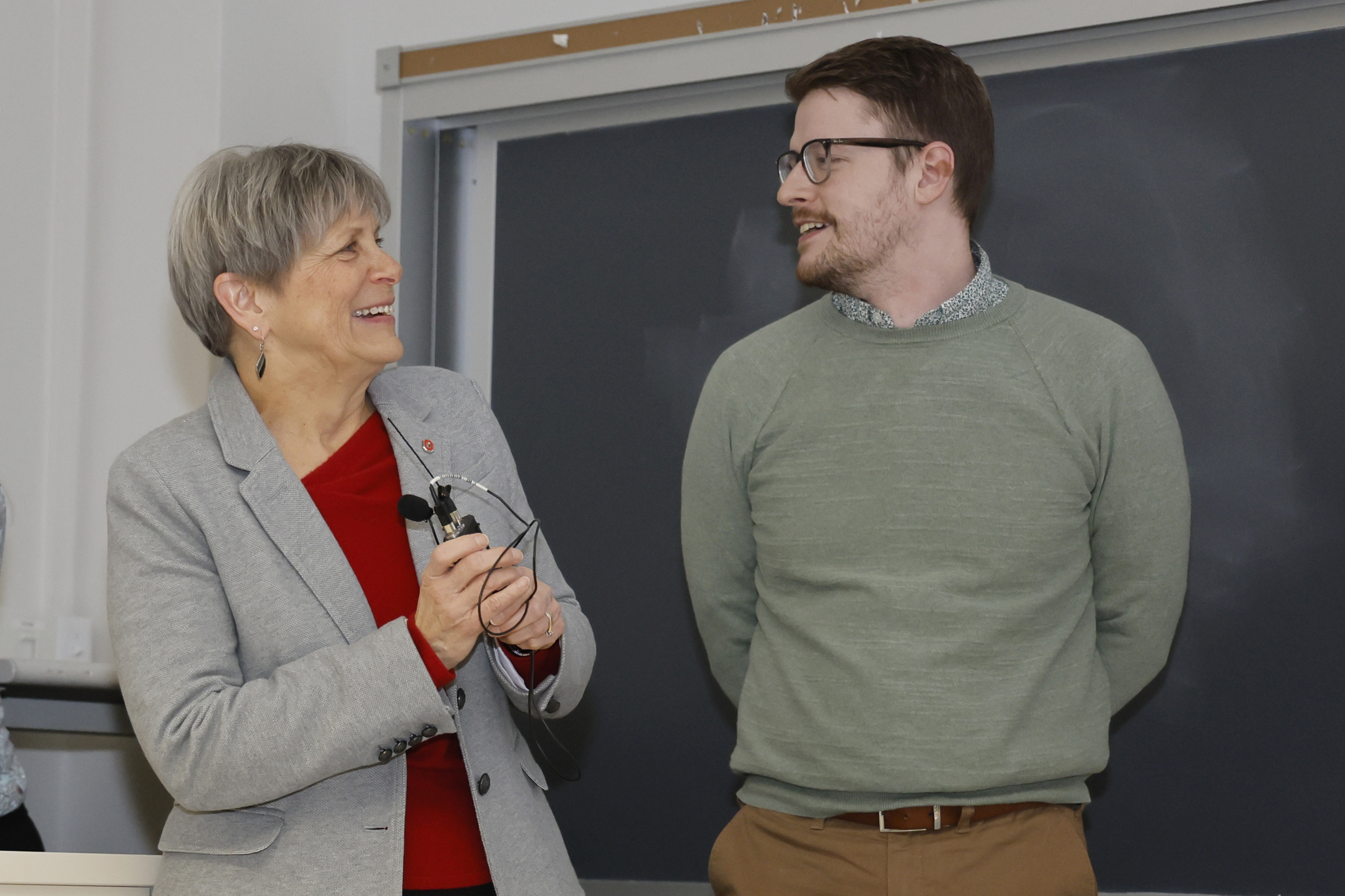 College of Pharmacy Dean Deanna Kroetz congratulates Zachary Woods on receiving the Alumni Award for Distinguished Teaching