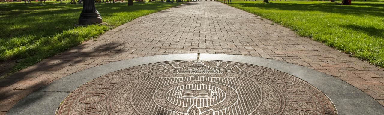 Picture of the Seal of The Ohio State University on the Oval.