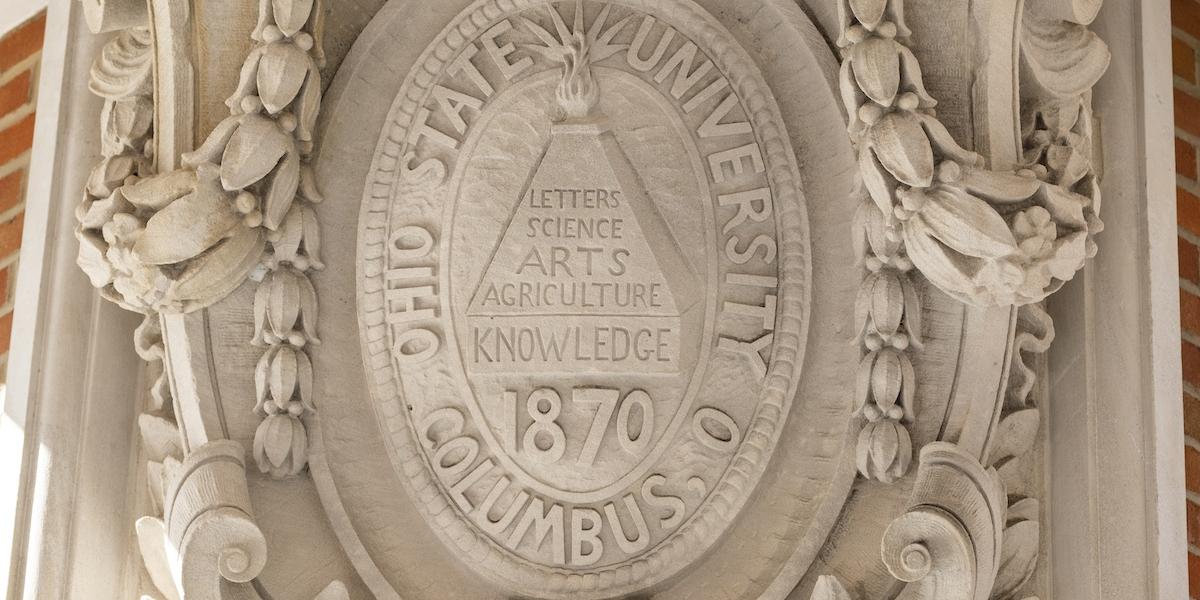 Picture of stonework depicting the seal of The Ohio State University.
