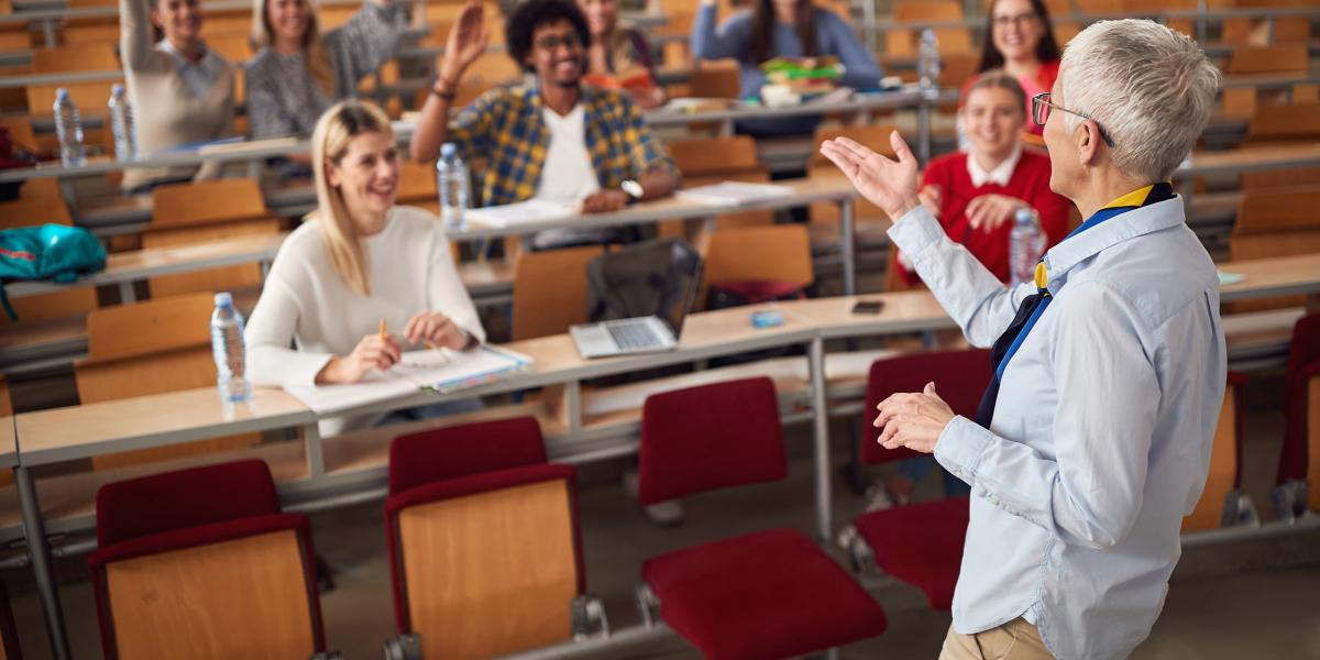 professor lectures to class from the stage.