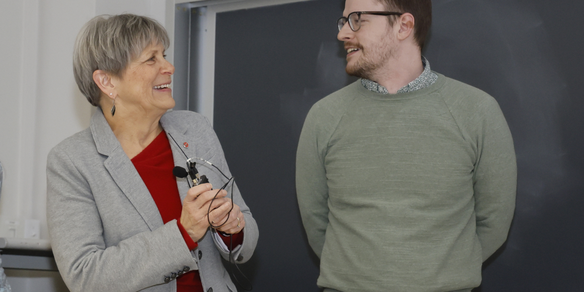 College of Pharmacy Dean Deanna Kroetz congratulates Zachary Woods on receiving the Alumni Award for Distinguished Teaching