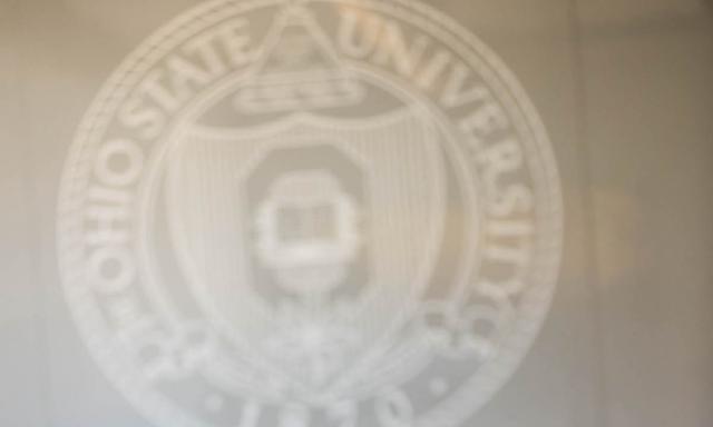 Picture of the seal of the Ohio State University on a classroom wall.
