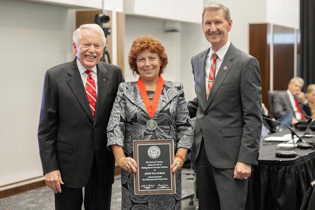 Ohio State Board Chair John Zeiger, Judit Puskas and Ohio State President Ted Carter gather for a photo of Puskas with her award medal and plaque.