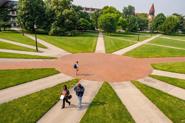 Students walk along the Oval.
