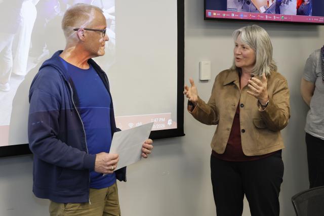 Brent Sohngen being congratulated by the dean