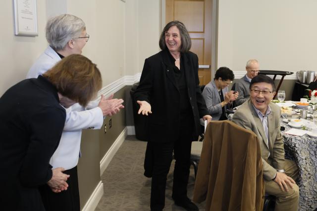 Claudia Turro  laughs with colleagues