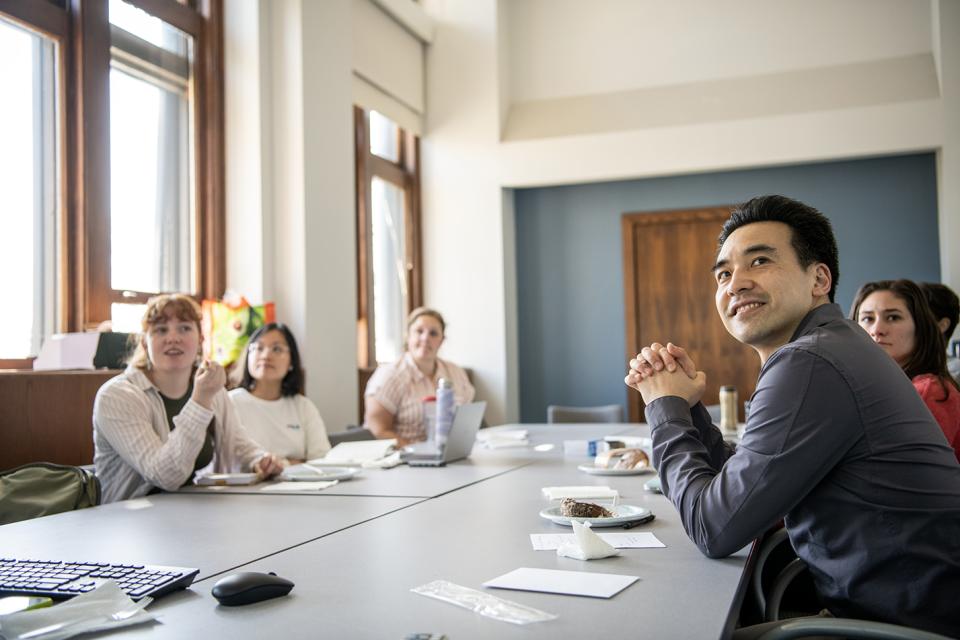 Professor listening to a presentation