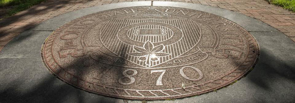 Seal of The Ohio State University in the Oval at Ohio State.